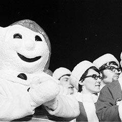 Bonhomme Carnaval applauds alongside members of the Canadian delegation during the Saskatoon Winter Games.